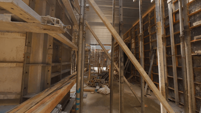 construction site with scaffolding and beams