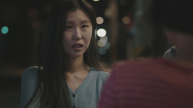Nighttime conversation on a city street