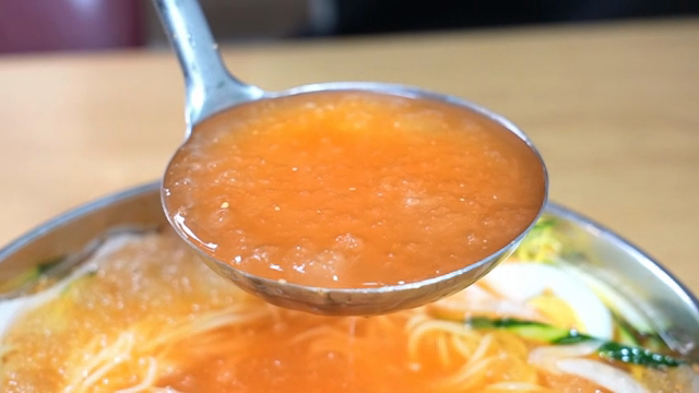 Cold Buckwheat Noodles in a metal bowl with broth