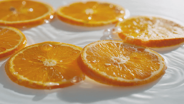 Orange slices floating on water