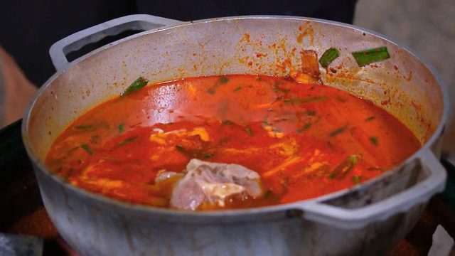 Putting meat in stew