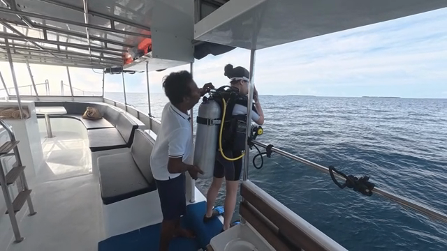 Preparing for a scuba dive on a boat