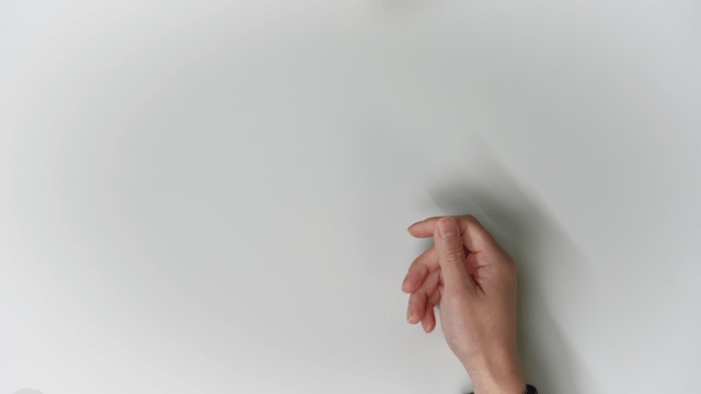 Hands exchanging Korean and US currency