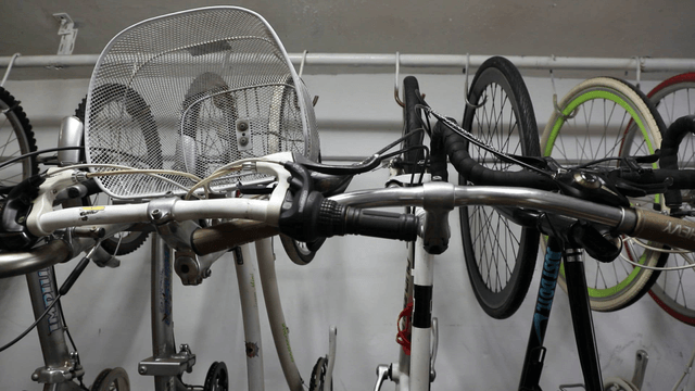 Bicycles hanging on a rack indoors