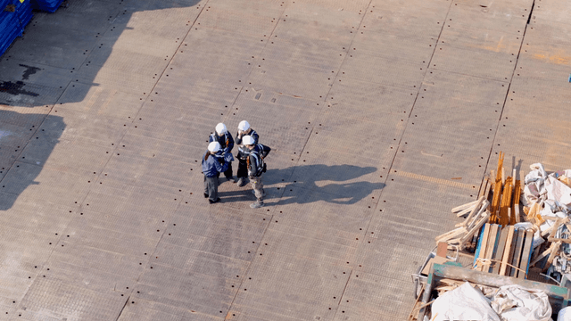 Workers discussing on a construction site