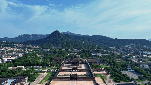Aerial view of a historic palace and cityscape