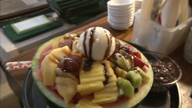 Shaved ice topped with plenty of fruits