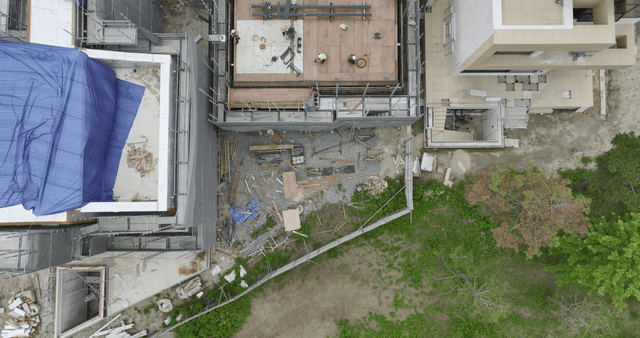 Construction site with workers and materials