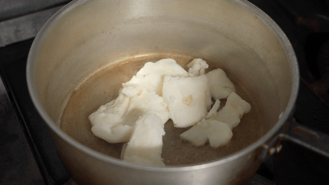 Pork fat being added to hot pot