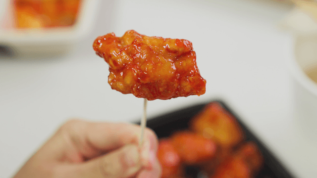Spicy chicken gangjeong on a stick