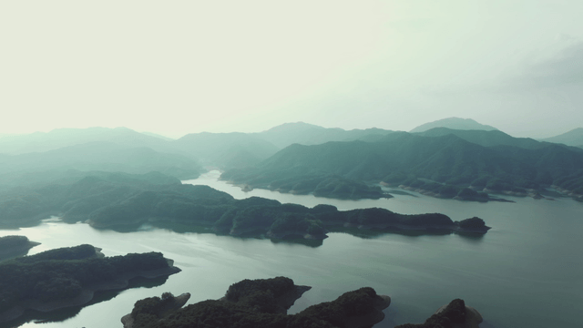 Serene lake surrounded by lush mountains