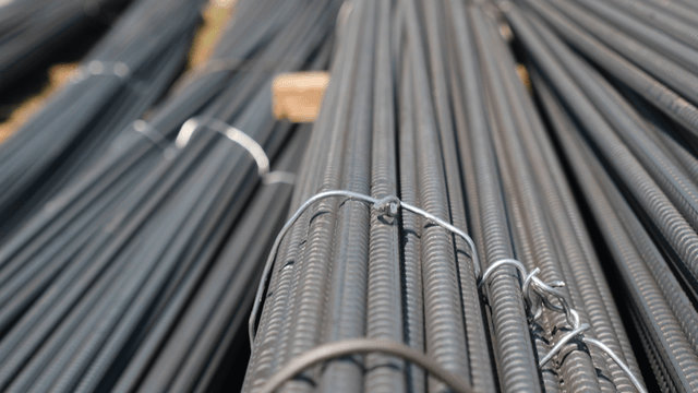 Stacks of steel rebar on a construction site