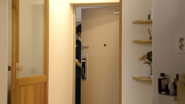 Young man walking out through front door