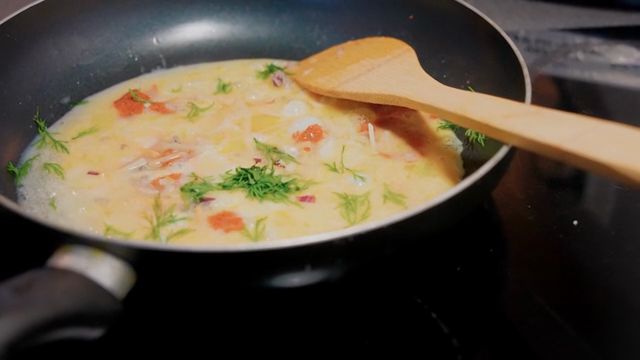 Omelette cooking in a frying pan