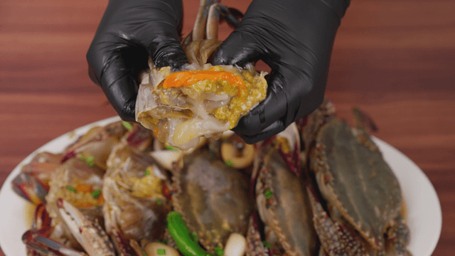 Fresh marinated crab being prepared