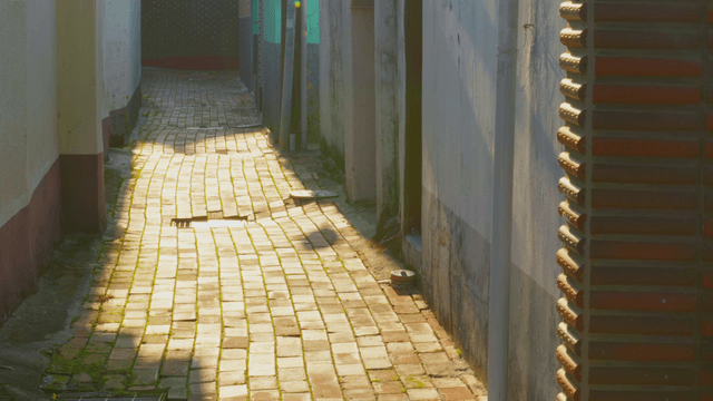 Narrow alleyway with sunlight
