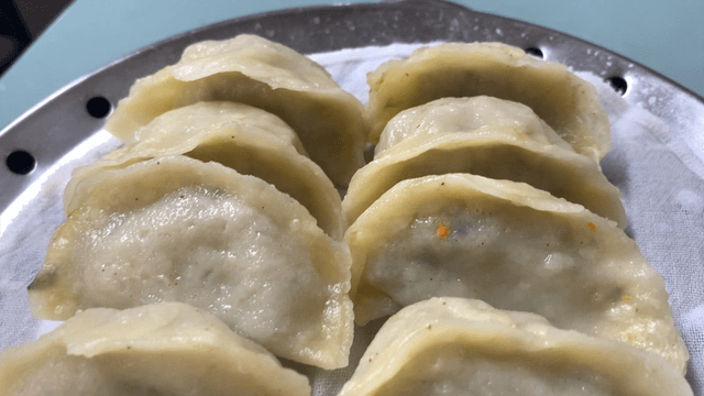 Steamed dumplings neatly arranged in a steamer