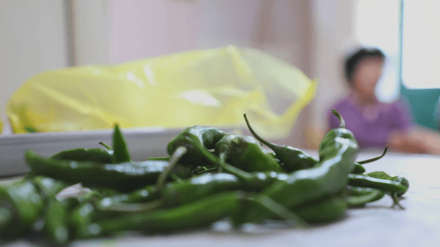 Green chili pepper on the table