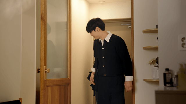 Newlywed couple entering cozy apartment