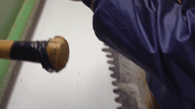 Worker handling textile materials in factory