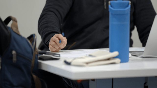 Person writing down work notes