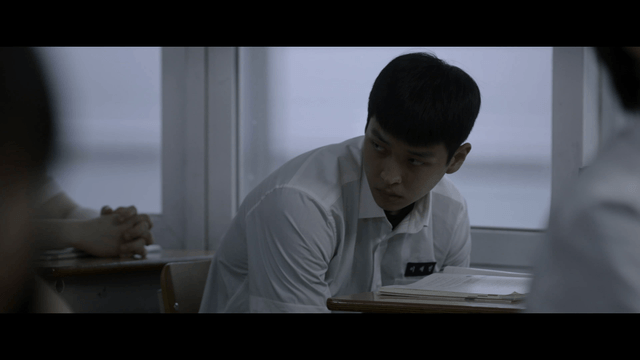 Student glaring at classmate during lesson