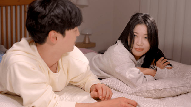 Couple resting together in cozy bedroom