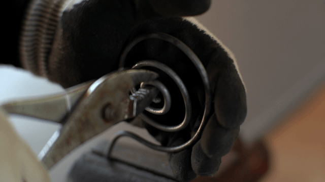 Metal spiral being crafted with precision