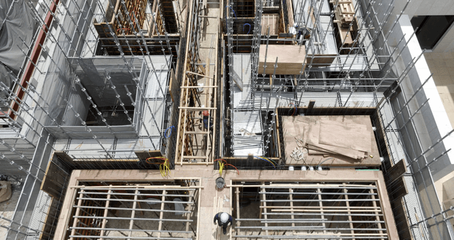 Construction site with workers and materials