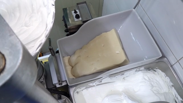 Dough being prepared in a kitchen