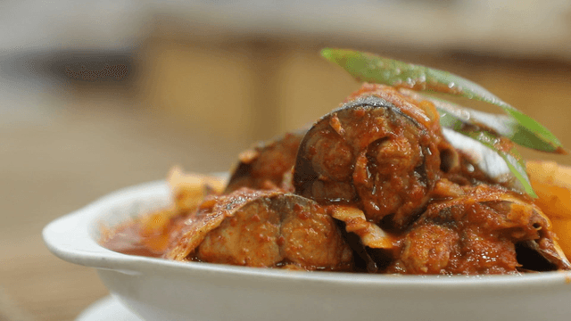 Spicy mackerel and radish stew served in a white bowl