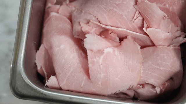 Ham slices filled on metal tray