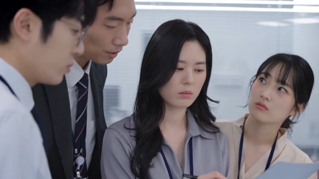 Office workers discussing a project