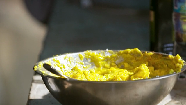 Squeezing lime juice into a bowl of guacamole