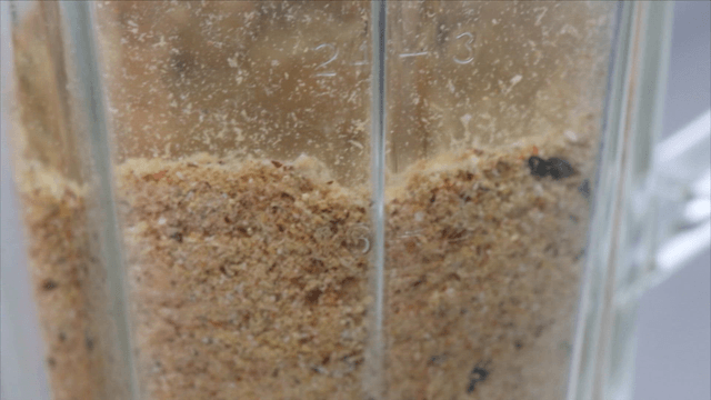 Blender grinding assorted vegetables and dried seafood