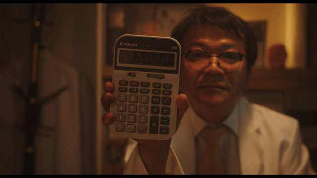 Doctor showing calculator