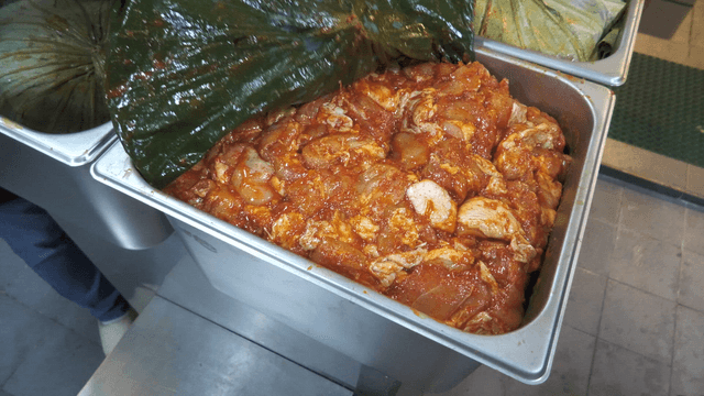 Seasoned stir-fried chicken wrapped in a leaf