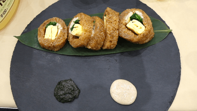 Yakbap gimbap served with sauce on a plate