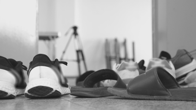 Shoes and slippers scattered on the floor
