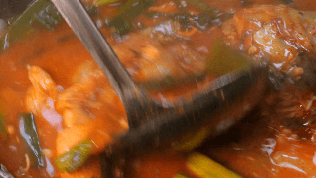 Spicy trout stew boiling in pot