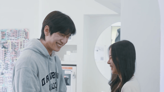 Happy couple smiling at a four-cut photo studio