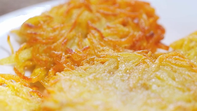 Golden brown potato pancakes on a plate