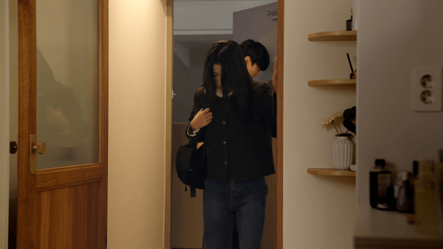 Couple arriving home with cold expression after work