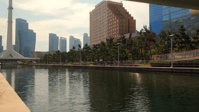 Modern cityscape with a calm river