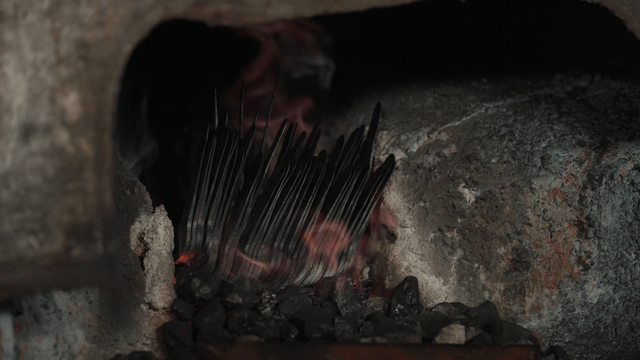 Metal pieces heated in brazier