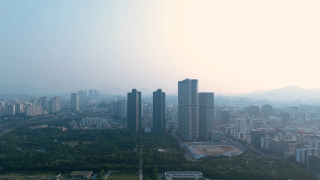 Aerial view of Seoul city harmonized with green forest