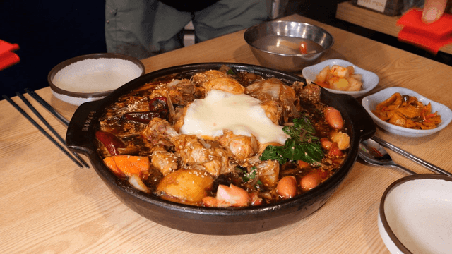 Cheese braised chicken served with side dishes