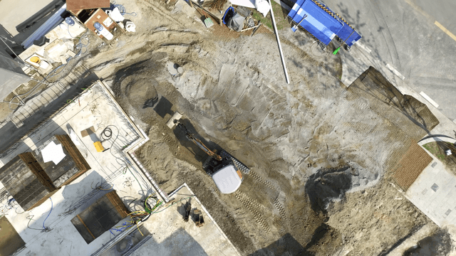 Construction site with excavator in action