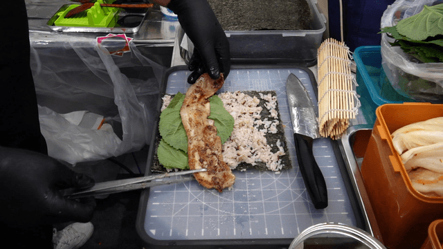 Chef preparing pork belly gimbap