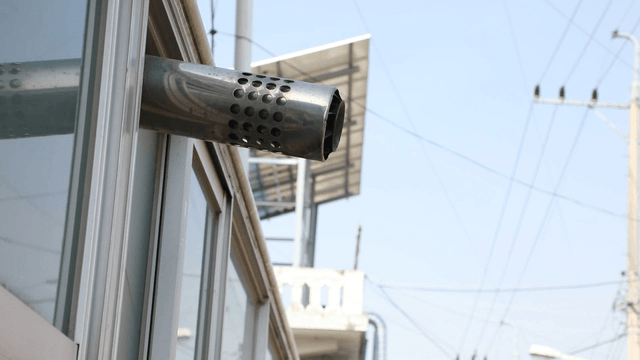 Metal exhaust pipe on a building